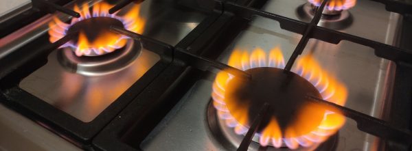 Natural gas burns orange yellow when there is a lack of oxygen. Danger of carbon monoxide poisoning in the kitchen gas stove